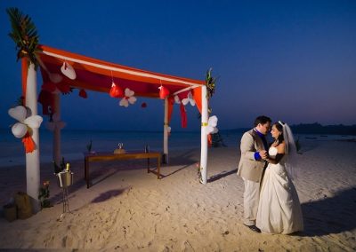Wedding couple on the beach, after sunset
