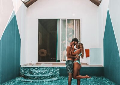 Couple beside the private plunge pool of a Pool Suite at Munjoh Ocean Resort
