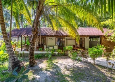 Two-bedroom Royal Chalet surrounded by tropical gardens at Munjoh Ocean Resort