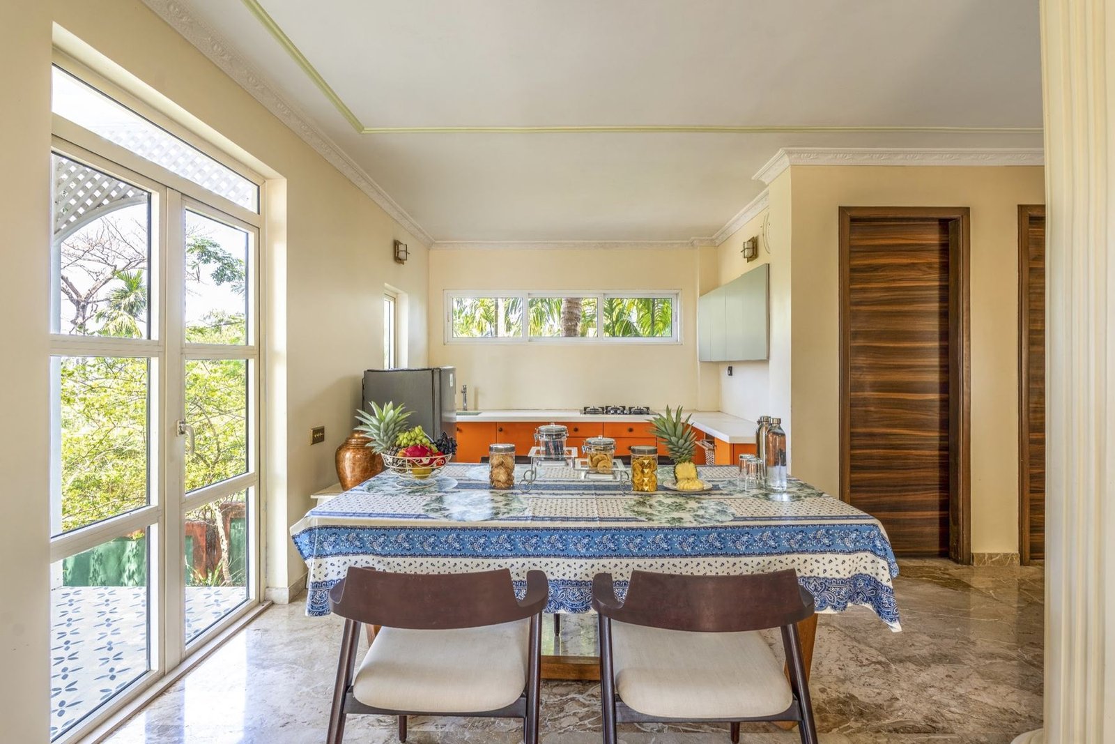 Dining table beside the kitchen in Kohinoor Residence at Munjoh Island House