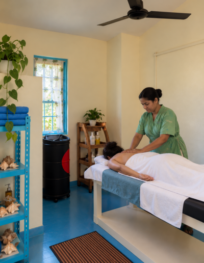 Guest receiving a massage in a Shaantim Spa treatment room at Munjoh Ocean Resort